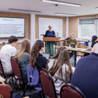 Classroom full of students with tutor teaching